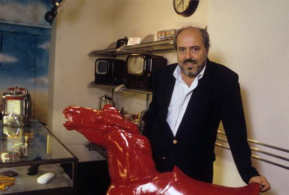 Elio Fiorucci Next To A Sculpted Red Horse