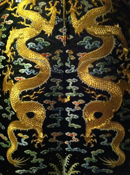 Detail: Empress's sleeveless ceremonial surcoat, Qing dynasty, Yongzheng period 1722–35, satin, 140.0 cm (centre back), 124.0 (hem width) courtesy The Palace Museum, Beijing in situ at the National Gallery of Victoria