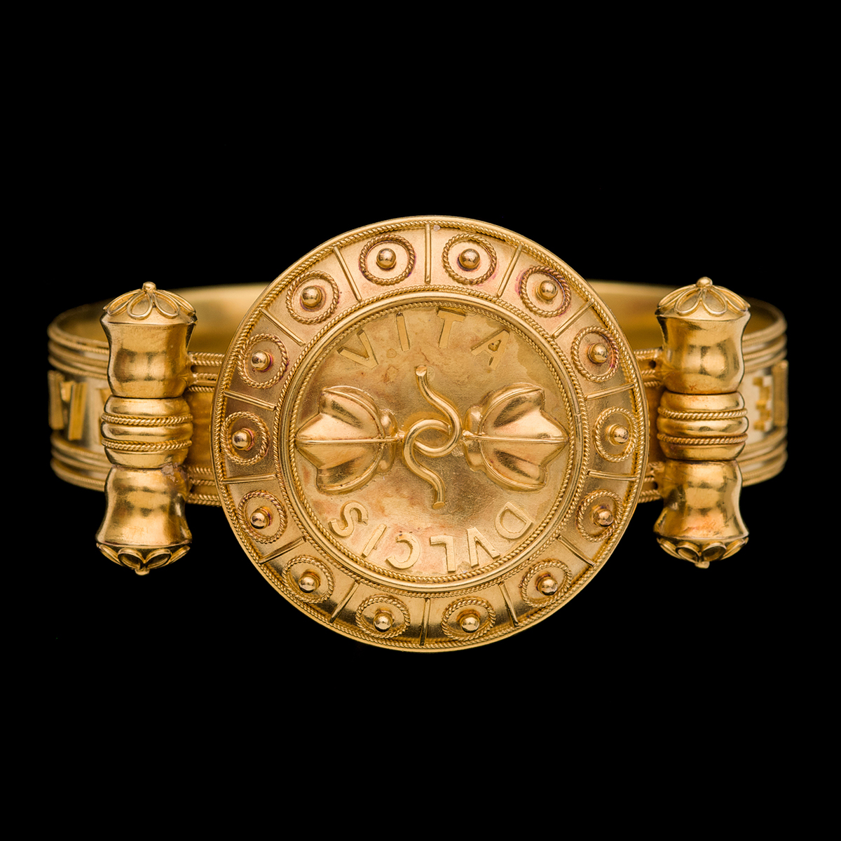 Gold 'archaeological style' bangle, signed John Brogden