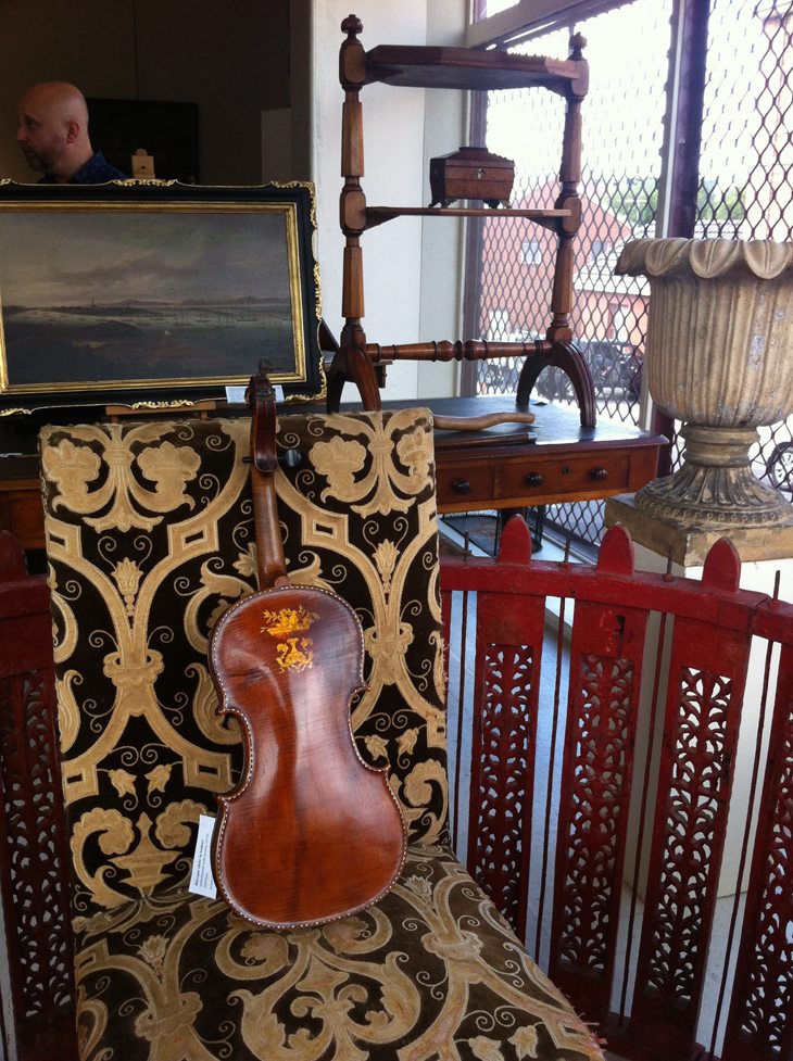 Antique violin on a chair; Warwick Oakman Antiques Gallery, Battery Point, Hobart, Tasmania
