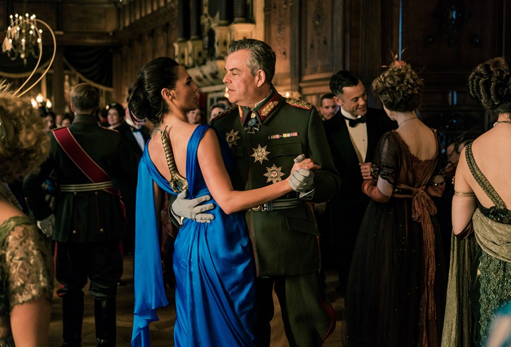 Gal Gadot as Wonderwoman dancing with the evil Ludendorff, Danny Huston, courtesy Warner Brothers