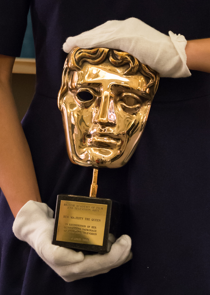 The honorary BAFTA presented to Her Majesty The Queen by Sir Kenneth Branagh at Windsor Castle, 4 April 2013, in recognition of Her Majesty's outstanding patronage of the film and television industries. The BAFTA is on display in 'Royal Gifts', the special exhibition at the Summer Opening of Buckingham Palace, courtesy Royal Collection Trust / (c) Her Majesty Queen Elizabeth II 2017